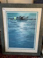 Full view of framed art print showing polar bear emerging from icy water with moonlight reflecting on the surface, textured green barn wood style frame.