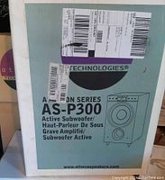 Box of the Athena Technologies AS-P300 active subwoofer showing product name, brand, and basic sketch of the subwoofer.