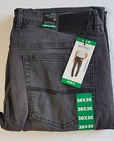Folded dark grey jeans with tags showing size 38x30 and Buffalo David Bitton branding.