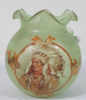 Front view of the light green frosted glass rose bowl with hand painted portrait of Chief Tecumseh surrounded by orange and gold floral accents.