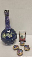 Full view of the blue-purple dragon vase with four enamel boxes and the egg in display box, showing size and grouping