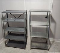 Photo of two metal shelving units side by side against a wall showing condition and design.