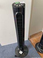 Front view of the black Honeywell tower fan showing its height and base.