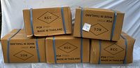 Five sealed boxes labeled RCC made in Thailand, each presumably containing ten black utility bags.