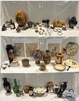 Full view of all decorative items arranged on shelves.