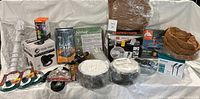Photo showing the entire assortment of outdoor items including coconut liners, garden hose, bird feeders, glue traps, wheels, and more.