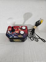 Double Dragon TV plug and play game console showing joystick, buttons, and AV cable.