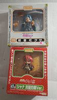 Two boxed anime figures: Hatsune Miku #170 in a white box and Shana #47A in a red box.