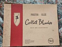Original box of Proctor-Silex Cocktail Blender with branding and price tag