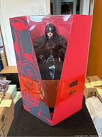 Front view of Barbie Star Wars Darth Vader doll in original red and black collector packaging