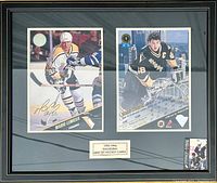 Framed display of two Mario Lemieux Pittsburgh Penguins hockey cards from the 1993-1994 Leaf Set, including an autographed card and a statistical card, behind glass in a black frame.
