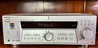 Front view of Sony STR-K502P stereo receiver showing power button, display screen, tuning and control knobs, DSP and Dolby Digital logos.