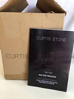 Box and instruction manual for Curtis Stone Mini Food Processor.