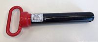 Photo showing the full hitch pin with red handle and black shaft on white background.