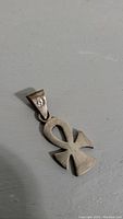 Front view of 925 sterling silver ankh pendant showing polished surface, symbol details and bail with hallmark stamp