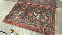 Full view of vintage carpet rug showing intricate multicolor pattern and condition