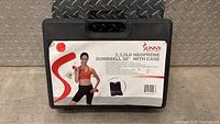 Closed black case with Sunny brand label showing a woman holding a dumbbell and product info, 2,3,5lb neoprene dumbbell set with case