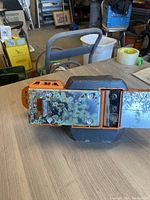 Top view of the metal plunger assembly showing wear and some oxidation or residue build-up.