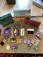 Full overview of all games and cards displayed on table, showing all boxes and inserted items