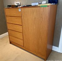 Front left angle view showing five drawers and right-side cabinet