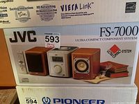 Boxed JVC FS-7000 Ultra Compact Component System including image of front on box with system shown