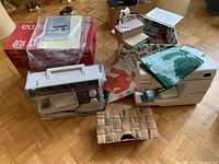 Lot overview showing two machines, box, basket and supplies