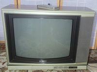 Entire vintage Sony Trinitron TV showing screen and speaker design.