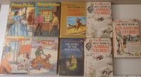 Eight vintage youth and children's books arranged flat showing cover art.