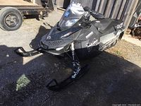 Front left angled view showing body panels, skis and windshield