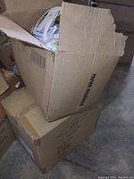 Box showing shipping and handling labels and indicating a case of paper hygiene products.