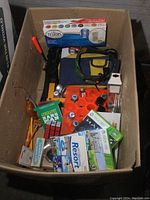 Photo of the entire box showing various hobby supplies and games inside