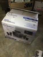 Closed box showing Granger Bessel branding and product image, advertising 2500W power, Bluetooth, HDMI, HDTV and MP4 support.