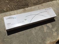 Box of Ashley Aries LED Linear Chandelier, showing branding and model details