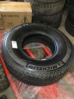 Single Michelin LTX tire in size LT285/75R16 with prominent white Michelin branding and logo on sidewall, showing like new tread.
