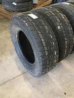 Photo showing side view of two Kelly Safari ATR truck tires with visible tread pattern.