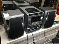 Front view of the complete Aiwa stereo system with speakers