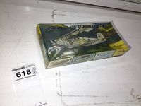 Box image showing front and top with vintage Focker D.VII biplane artwork and yellow Heller branding.