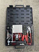 Top view of open plastic case showing entire multi tool set new in box.