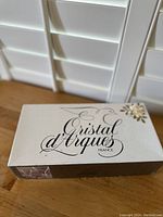 Box top of Cristal d'Arques France showing brand and floral design