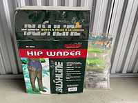 Box of Bushline Hip Wader showing brand and product details with size and features.
