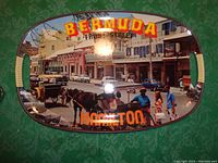 Full view of the serving tray showing the street scene with buildings, horse-drawn carriage, cars, and people. Text reads 'BERMUDA' and 'HAMILTON'.