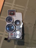 Front view of Wollensak Model 43 showing three lenses, exposure dial and viewfinder window.