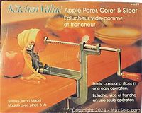 Front of original packaging box showing Kitchen Value branding and function description of apple parer, corer, and slicer tool.