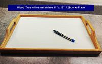 Rectangular wood tray with white melamine bottom and pen for scale