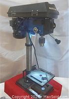 Full view of MasterCraft drill press showing base, column, and head with chuck and LED light