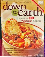 Front cover photo showing the cookbook titled 'Down to Earth' by Weight Watchers with a bowl of chunky minestrone soup.