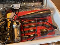 Assorted USB camera, black metal tools, and cables