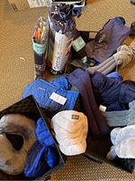 Overview of three baskets containing various relaxation pillows and compresses including Spoonk and ReVix branded items