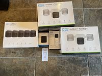 Overview of all unopened Blink product boxes: 5-pack camera kit, two floodlight cameras, sync module, video doorbell