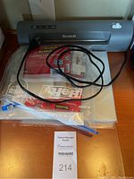 Scotch thermal laminator with bundled laminating pouches and power cord